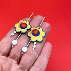 BIG BOLD YELLOW BLOSSOM earrings.... statement earrings for dressing up with just a bit of swing.  Wear what you love! Handmade enamel floral earrings perfect as a birthday or anniversay gift. handmade earrings... sawn, soldered, sanded,  and enameled... ..handfabricated and colored with ground glass these enamel earrings measure aproximately 2 1/4" long by 7/8".  * NOTE: The earring's enamel surface has tiny flecks of other colors embedded. The earrings are handmade and no two earrings are perfectly alike.  ♦ ready to ship ♦ measure approximately 2 1/4" long by 7/8" wide ♦ packaged in a gift box ...the perfect gift for someone special... or yourself.  **Photo by Richard Stachmann on Unsplash @metalobjects - brandishing a torch and hammer for fun! Bold Enamel Jewelry For Gifts, Bold Enamel Jewelry Gift, Bold Enamel Jewelry As A Gift, Artsy Yellow Dangle Jewelry, Playful Yellow Drop Earrings Jewelry, Fun Yellow Hand Painted Earrings, Fun Hand Painted Yellow Earrings, Playful Yellow Flower Jewelry, Playful Yellow Drop Earrings