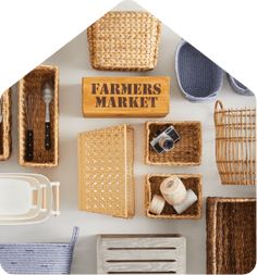 the farmers market sign is surrounded by wicker baskets and kitchen utensils on display