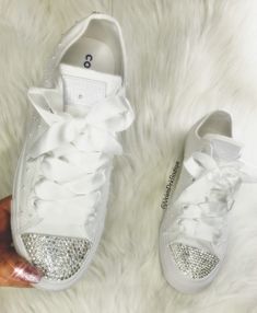 Bling Custom White Converse With Beautiful Swarovski Crystals Satin Ribbon Laces And White Pearls These are one of a kind beautiful custom made sneakers, embellished with authentic Swarovski Diamond elements, The most expensive Swarovski® crystals in the world, imported from Austria. Shoes are purchased from an authorize retailer new in the box with tags. Hand customized by a certified Swarovski® artist. Shoes arrive beautifully packaged in original box. You will receive a one of a kind item mad White Lace-up Custom Sneakers With Rhinestones, White Custom Lace-up Sneakers With Rhinestones, White Low-top Custom Sneakers With Bling, Lace-up Sneakers With Rhinestones For Anniversary, Wedding Low-top Sneakers With Rhinestones, Custom White Converse, Crystal Sneakers, Swarovski Nike, Red Chucks