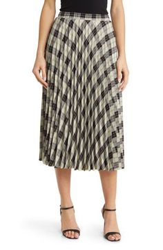 Preppy plaid is all the rage on this cotton-forward midi skirt made with a stretchy smocked waist. 99% cotton, 1% spandex Dry clean Made in the USA Spring Plaid Skirt For Work, Chic Pleated Plaid Skirt, Spring Plaid Pleated Skirt, Plaid Cotton Skirt For Work, Preppy Plaid, Pleated Midi Skirt, Quilted Jacket, Smocking, Womens Bottoms