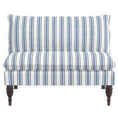 a blue and white striped couch with wooden legs