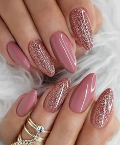 24-Piece Almond Press-On Nails Set in Pink with Pink Sparkly Accent Nails, a stunning and chic collection designed to enhance your nails with a touch of sparkle. Featuring a classic almond shape, each nail in this set is adorned with a lovely pink base, complemented by strategically placed pink sparkly accent nails for a dazzling and eye-catching look. What's Included: FULL SET (24 nails): A meticulously crafted collection of almond-shaped nails, featuring a chic pink base with carefully selecte Mauve Nails, Glitter Manicure, Valentine Nails, Modern Nails, Colorful Nails, Pink Nail Art, Trendy Nail Art, Fake Nail, Nail Designs Glitter