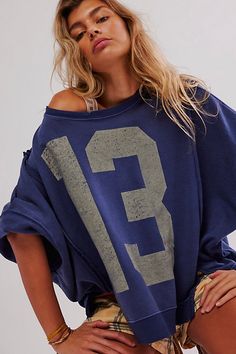 Just as cool as it is classic, this goes-with-anything long sleeve tee is featured in a slouchy, relaxed fit with worn, varsity-inspired number graphic at front for a true lived-in look. **Fit:** Slouchy, relaxed fit **Features:** Scoop neckline, dropped shoulders, side slits at bottom, ribbed hems, defined seaming **Why We | We The Free Graphic Camden Pullover at Free People in Blue, Size: L Cute Graphic Crewneck, Free People Shirts & Tops, Free People Loungewear, Free People Hoodie, Small Brands Clothing, Nyc Fits Winter, Free People Clothes, Free People Outfits Aesthetic, Cute Clothes To Buy