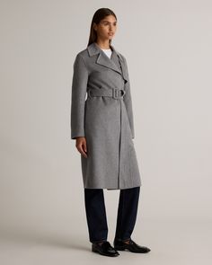 Crafted from premium, soft-to-the-touch Merino wool, this Double-Faced Merino Wool Trench Coat offers the perfect balance of warmth and lightness, ideal for layering in cooler months. This classic wool coat features a flattering waist belt to cinch your silhouette, while the classic trench elements - like the notched lapels and storm flap - add a modern touch.  | Quince | Women's Double-Faced Merino Wool Trench Coat in Heather Grey, Size XL, Wool/Nylon Spring Cashmere Outerwear For Layering, Gray Outerwear With Concealed Placket For Work, Gray Belted Long Sleeve Outerwear, Chic Gray Business Outerwear, Long Sleeve Cashmere Outerwear For Work, Cashmere Outerwear With Lapel Collar For Fall, Tailored Gray Wool Coat For Fall, Cashmere Outerwear For Work, Chic Cashmere Outerwear For Fall