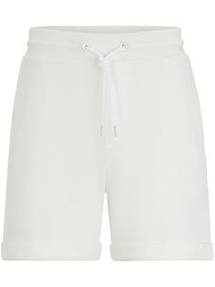 white cotton fine ribbed elasticated drawstring waistband slip pockets to the sides above-knee length White Drawstring Shorts For Spring, White Bermuda Shorts With Elastic Waistband For Spring, Spring White Bermuda Shorts With Elastic Waistband, White Bermuda Shorts With Elastic Waistband, Cotton Drawstring Shorts For Daywear, White Shorts With Pockets For Daywear, White Bottoms With Ribbed Waistband And Short Shape, White Relaxed Fit Cotton Bermuda Shorts, White Bermuda Bottoms For Loungewear