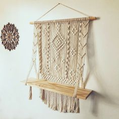 These hanging macrame shelves are made from 4 mm (1/6 inch)  natural white cotton rope. They can also be made of black cotton rope.  Dimensions: The wooden plank have been made of  spruce wood, 23'' (60 cm) long and 8'' (20 cm) wide. Longer and shorter wooden planks are also available for purchase, please contact me for custom order. Width - 23'' (60 cm) Height -  31'' (80 cm) ------------------- Please message me if you are uncertain of the description or whether there is an option you would like but I haven't covered it above. I can make this shelf larger or smaller according to your needs. I can also make a different pattern behind the wooden plank. Due to computer monitor and camera settings the actual colors might be slightly different. Have a look at my other plant hangers here: http Macrame Shelves, Macrame Hanging Shelf, Indoor Plant Hangers, Macrame Shelf, Wooden Plank, Macrame Wall Hanging Patterns, Hanging Table, Diy Plant Hanger, Macrame Hanger