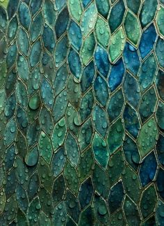 water drops on the surface of a mosaic tile wallpapered with green and blue colors