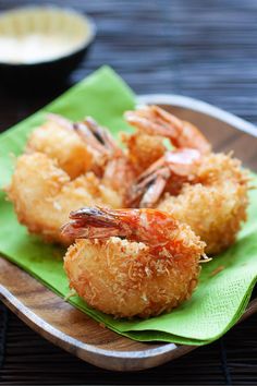 fried shrimp on a plate with dipping sauce