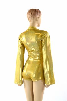 "This item is made to order, please read all the way through the listing before purchasing! This bodysuit is made of a gold metallic holographic sparkly jewel spandex. Long Bell cut sleeves and boy cut legs. This fabric has an amazing holographic sparkle! Deep, plunging v neckline. Four way stretch for a figure forming fit. This bodysuit is unlined. Womens Sizing (See below for instructions on where measurements should be taken) XXS: Bust 29\"-30\" / Waist 22\"-23\" / Hips 30\"-32\" Extra Small: Metallic Stretch Bodysuit For Club, Metallic Shiny Fitted Bodysuit, Fitted Metallic Shiny Bodysuit, Stretch Shiny Bodysuit For Party, Metallic Shiny Bodysuit For Night Out, Disco Metallic Bodysuit For Club, Metallic Stretch Unitard For Night Out, Glamorous Metallic Bodysuit For Night Out, Party Shimmer Stretch Bodysuit