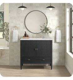 a bathroom vanity with a round mirror above it