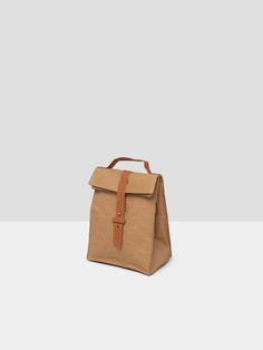 A touch of nostalgia with a contemporary update. The extra-thick insulated lining keeps your lunch fresh, while the outer material is easy to clean and water resistant. It’s the classic paper bag — made reusable. Made with #SupernaturalPaper Everyday Reusable Rectangular Lunch Bag, Brown Rectangular Lunch Bag For Everyday Use, Eco-friendly Recyclable Lunch Bag, Eco-friendly Rectangular Lunch Bag, Classic Paper, Versatile Rectangular Lunch Bag For On-the-go, Lunch Cooler, Paper Lunch Bags, Paper Lunch