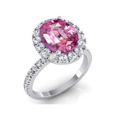 a pink diamond ring with diamonds around it