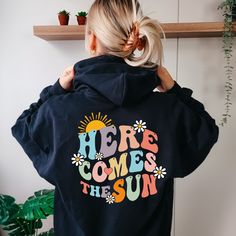 Here Comes The Sun Text Hoodie, Aesthetic Gift for Womens, Oversized Hoodie, Beach Hoodie for Girls, Positive Hoodie, Trendy Summer Hoodie 👉HOW TO ORDER👈 1️⃣  Choose your T-shirt color 2️⃣  Choose your T-Shirt size 3️⃣  Choose your design & text color 4️⃣ Need more Items? Add the current item in the cart. And If you like to add more items to your order please press the back button and repeat steps 1-3 again. 5️⃣Once all your desired items are in your cart you may complete your order by enterin Vsco Style Long Sleeve Hoodie With Letter Print, Winter Vsco Hoodie With Letter Print, Oversized Long Sleeve Vsco Hoodie, Fun Cotton Hoodie, Fun Cotton Hooded Hoodie, Cotton Vsco Hoodie With Graphic Print, Cotton Graphic Print Vsco Hoodie, Fun Hooded Sweatshirt For Streetwear, Cotton Vsco Hoodie With Relaxed Fit