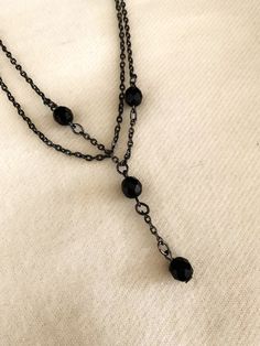 This black bead necklace has two 16" chains.  On one of the chains hangs an extra 1 3/4 inch extension with 2 of the 4 beads.  It has a nice sturdy clasp and is sure to please! Thank you for considering my items! So How Can I Say This Vintage Item Has Never Been Worn??? Most of the jewelry I sell is from a warehouse/business buy-out purchased from a retired jewelry wholesaler who did business from the 1970s thru the 1990s --- so has never been worn or sold at retail - only stored!  Much of this Warehouse Business, Double Chain Necklace, Black Bead Necklace, Double Chain, Wet Seal, Wholesale Jewelry, The Limited, Black Beads, True Vintage