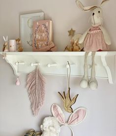 a shelf with stuffed animals and decorations on it