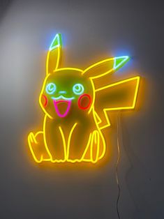 a neon sign with a glowing pikachu on it's face and eyes