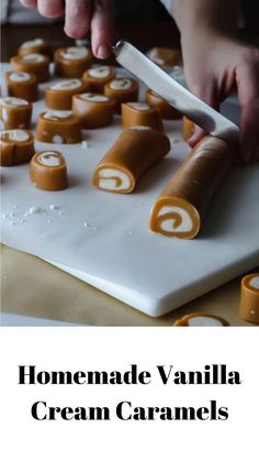 homemade vanilla cream caramels on a cutting board with a person using a knife to cut them