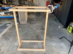 a wooden stand in the middle of a garage