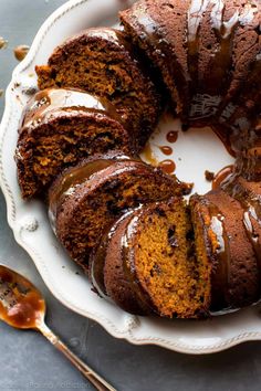 a bundt cake on a plate with caramel drizzle