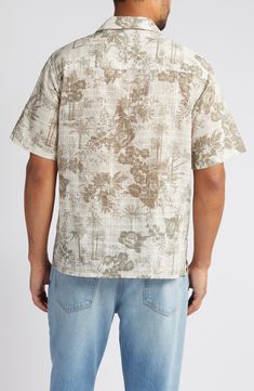 Ready for your packing list, this cotton shirt features a muted print of swaying palms and fresh flowers. 27 1/4" length; 42" chest length (size Medium) Front button closure Notched collar Short sleeves 100% cotton Machine wash, line dry Imported Collared Cotton Shirt With Hibiscus Print, Cotton Collared Shirt With Hibiscus Print, Cotton Hibiscus Print Collared Shirt, Patterned Cotton Hawaiian Shirt For Spring, Collared Cotton Hawaiian Shirt With Floral Print, Cotton Collared Hawaiian Shirt With Floral Print, Casual Button-up Shirt With Hibiscus Print, Cotton Floral Print Collared Camp Shirt, Floral Print Cotton Camp Shirt With Camp Collar