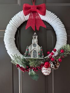 a paper plate wreath with a church on it