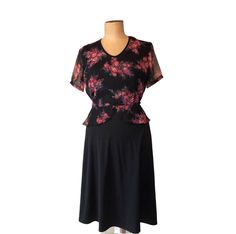 Black Floral Dress with roses. ⏰ Vintage 70s Here is a really sweet little black dress with floral overlay on the top.  Sheer short sleeves.   Flattering scalloped floral material over waistline.   Material has some stretch.  Zippered back with round neckline.  Belt loops intact unfortunately missing the belt.   Made by Jamaine Melbourne  vintage size sixteen but probably more like size 10 to 12, please check measurements in inches -  Approximately modern size range -  Medium or 12 but please ch Elegant Short Sleeve Dresses With Rose Print, Elegant Short Sleeve Rose Print Dresses, Floral Print Short Sleeve Midi Dress For Formal Occasions, Formal Short Sleeve Floral Print Midi Dress, Formal Short Sleeve Floral Midi Dress, Black Floral Print Short Sleeve Midi Dress, Black Short Sleeve Midi Dress With Floral Print, Black Floral Print Midi Dress With Short Sleeves, Black Short Sleeve Dress For Garden Party