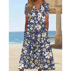 Royal Blue A-line Summer Dress, Blue Floral Print V-neck Dress, Royal Blue V-neck Spring Dress, Beach V-neck Midi Dress With Pockets, V-neck Midi Dress With Pockets For Beach, Blue A-line Summer Maxi Dress, Summer Blue A-line Maxi Dress, Blue Shift Maxi Dress, Blue Casual Shift Maxi Dress