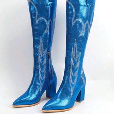 Gorgeous Metallic Blue Needle Point Detail Pointy Toe Chunky Heel Embroidered Stripe Pattern Western Cowboy Boots Side Zipper Upper Material: Sequins Lining Material: Polyester Insole Material: Polyester Outsole Material: Rubber Blue Pointed Toe Boots With Rhinestones, Blue Rhinestone Boots With Pointed Toe, Blue Rhinestone Pointed Toe Boots, Blue Rhinestone Boots For Spring, Spring Blue Boots With Rhinestones, Blue Embellished Party Boots, Embellished Blue Party Boots, Blue High Heel Boots With Rhinestones, Blue Party Boots With Rhinestones