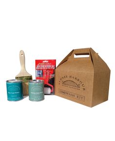 the contents of a craft kit including paint, brush and paper bag