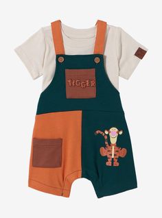 Dress your little one up in Disney fashion with this Winnie the Pooh -inspired overall set! Shirt included  the overalls feature a printed portrait of Tigger and puff print "Tigger" lettering on one pocket. With adjustable straps  this outfit is perfect for your little one's next playdate  nap  or trip to the Disney Parks. A BoxLunch Exclusive! Where To Shop For Baby Boy Clothes, 4 Month Old Outfits, Winnie The Pooh 1st Birthday Boy Shirts, Disney Boy Clothes, Boy Disney Theme Party, Pooh And Mickey Sharing Shirt, Disney Baby Boy Outfits, Winnie The Pooh Baby Stuff, Winnie The Pooh Baby Clothes