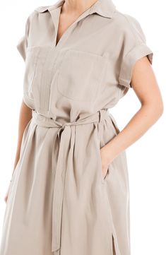 A simple sash belt defines the waist of this shirtdress framed with cuffed sleeves and a spread collar. 45" length Spread collar Short sleeves Unlined 85% rayon, 15% polyester Machine wash, line dry Imported Model stats: 5'10" height, 32" bust, 25" waist, 36" hip. Model is wearing size Small. Beige Belted Shirt Dress For Work, Beige Collared Belted Shirt Dress, Collared Belted Dress With Tie Waist, Solid Color Belted Shirt Dress For Daywear, Beige Belted Short Sleeve Shirt Dress, Beige Belted Shirt Dress For Office, Short Sleeve Belted Dress With Belted Cuffs For Work, Casual Beige Belted Shirt Dress, Taupe Spring Workwear Dress