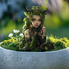 a doll is sitting in a planter filled with grass and flowers, surrounded by daisies