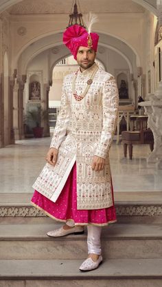 Handcrafted Designer Sherwani for groom made from the finest fabric will make you feel like a king on the happiest & most important day of your life. you can customize it according to your measurement as the fitting make it more beautiful to wear. COST INCLUDES SHERWANI,PANTS & STOLE(Dupatta) Semi-stitched White Nehru Jacket For Wedding, White Long Bandhgala For Eid, White Semi-stitched Sherwani For Festivals, White Sherwani With Cutdana And Long Sleeves, Festival White Semi-stitched Sherwani, White Long Nehru Jacket With Dabka, White Long Bandhgala For Ceremonial Occasions, White Fitted Bollywood Sherwani, Long White Nehru Jacket With Dabka