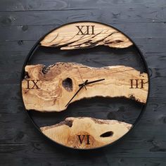 a clock made out of wood with roman numerals