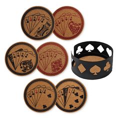 four coasters with playing cards on them and one has a black band around it