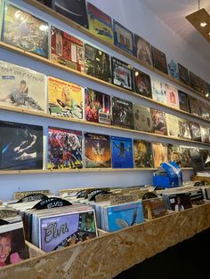 the wall is full of records and cds