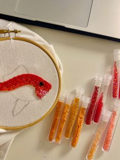 the embroidery project is being worked on with beads