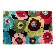 an area rug with flowers on the front and back side, in multicolored colors