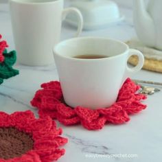 crocheted coasters on a marble table with coffee mug and teapot in the background