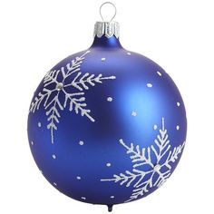 a blue ornament with white snowflakes on it