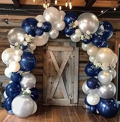 an arch made out of balloons and flowers