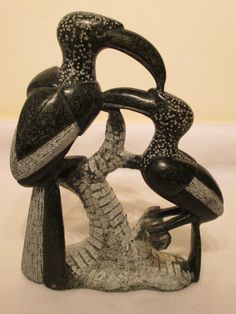 a black and white sculpture sitting on top of a table