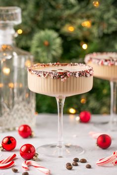 two desserts sitting on top of a table next to candy canes and christmas decorations