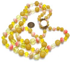 Multi Strand Beads - This is a double strand yellow glass, pink lucite, yellow sugar bead necklace. Shortest strand is 19" long, with additional strand slightly long, beads are .5" wide. Yellow Double Strand Beaded Necklace, Vintage Yellow Necklace With Colorful Beads, Yellow Single Strand Beads For Jewelry Making, Vintage Yellow Beaded Chain Jewelry, Vintage Yellow Jewelry With Beaded Chain, Vintage Yellow Single Strand Jewelry, Vintage Yellow Round Bead Necklaces, Vintage Yellow Jewelry With Colorful Beads, Vintage Yellow Polished Beads