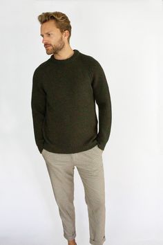 Model: WJ7906_OLIVE The Ford crew takes inspiration from the classic country jumper and transforms it into an every day, wardrobe staple. Made from 100% Merino Wool, making it super soft and 100% biodegradable. Available in 4 different colourways, match it with the Porter Beanie for the perfect mix and match, winter look. Made in England100% 7gge Merino wool Clean cut shape Crew neck Modern twist on a classic shooting jumper. Made in England Model is 6''1, has a 40" chest and wears a size M Green Wool Sweater With Ribbed Collar, Classic Green Sweater With Ribbed Cuffs, Green Sweater With Ribbed Cuffs For Work, Classic Green Wool Sweater, Green Sweater For Work, Classic Green Sweater With Ribbed Collar, Classic Green Workwear Sweater, Fitted Khaki Fall Sweater, Fitted Green Wool Sweater