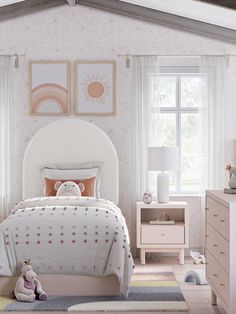 a child's bedroom with pink and white decor