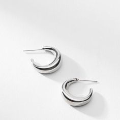 These crescent-moon-inspired earrings are just shiny enough to catch the light, but subtle enough to wear every day. Made from stainless steel. Minimalist Metal Earrings With Shiny Finish, Elegant Half Moon Metal Earrings, Elegant Semi-circle Metal Earrings, Elegant Crescent Hoop Earrings For Everyday, Minimalist Moon Earrings For Everyday, Minimalist Moon-shaped Everyday Earrings, Modern Semi-circle Earrings For Everyday Wear, Modern Semi-circle Earrings For Everyday, Elegant Half Moon Earrings For Everyday