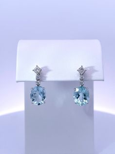 ✓ Stamped: 14K  ✓ Metal: Solid White Gold ✓ Aquamarine 11.00*7.00 millimeters 6 carats total weight. Loupe clean, light blue color. ✓ Diamonds 0.45 carats total weight H-I  SI1 Formal Blue Topaz Diamond Earrings Fine Jewelry, Formal Blue Topaz Diamond Earrings, Classic Blue Oval Diamond Earrings, Elegant Blue Oval Diamond Earrings, Elegant Blue Gia Certified Diamond Earrings, Formal Blue Pear-shaped Diamond Earrings, Elegant Light Blue Gemstone Earrings, Classic Blue Topaz Earrings With Diamond Accents, Elegant Blue Round Cut Diamond Earrings