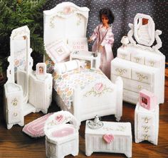 a doll house bedroom with furniture and accessories