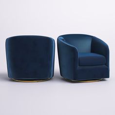 two blue chairs sitting next to each other on a white surface with one chair in the middle